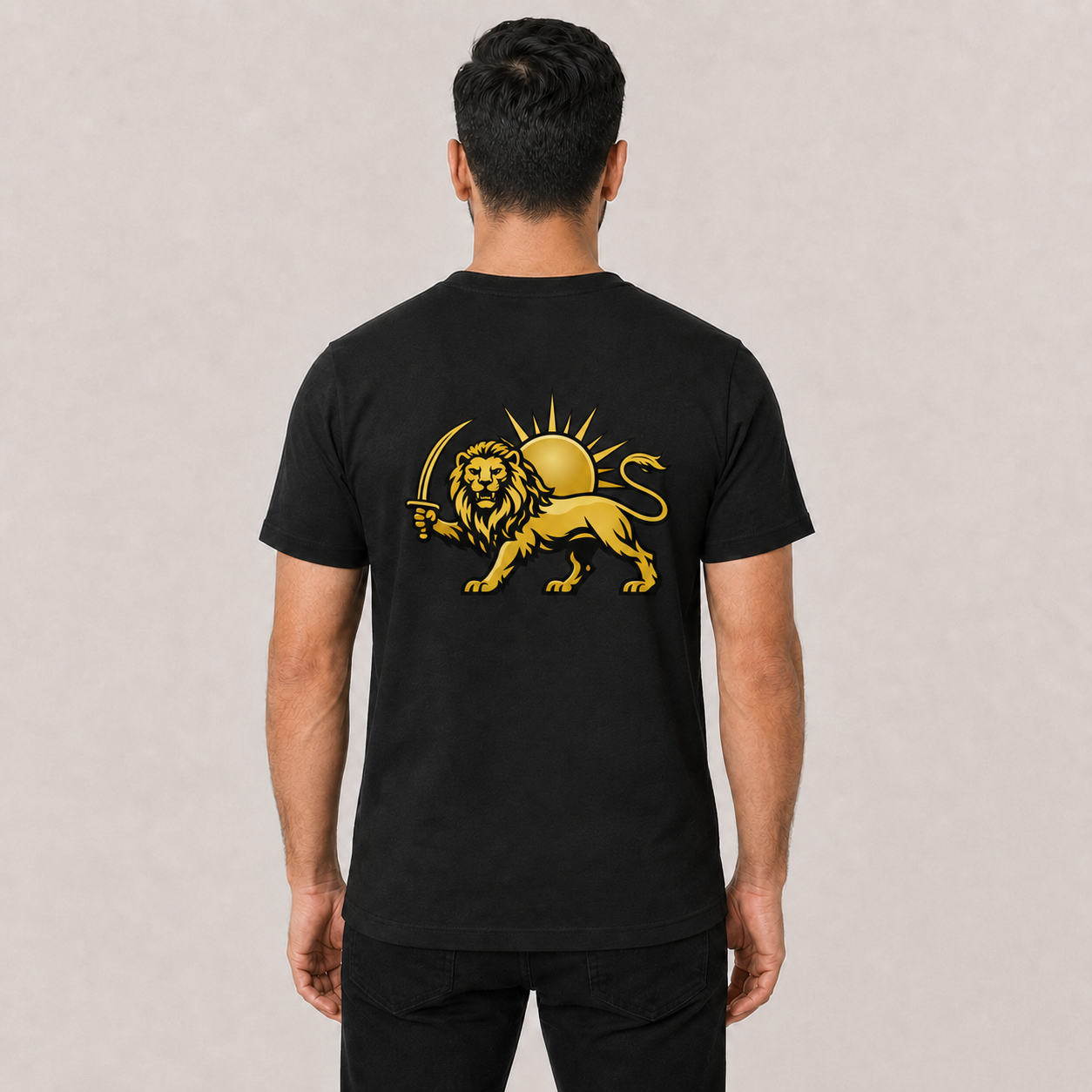 A man viewed from behind wearing a black t-shirt with a large gold lion and sun graphic printed on the back. Persian Shirokhorshid